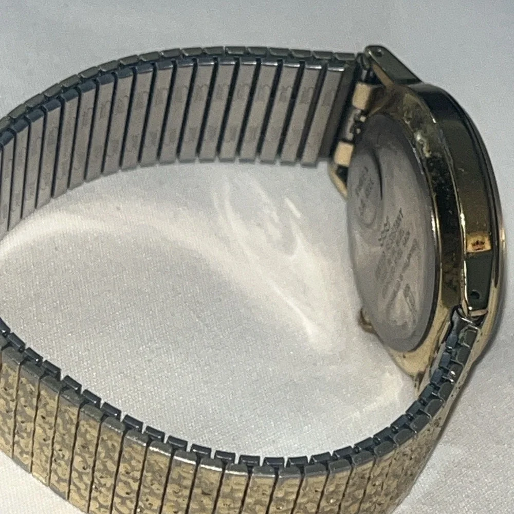 Vintage Gold Band Timex Watch. LA CELL. White Face. Metal Band. Needs Battery‎